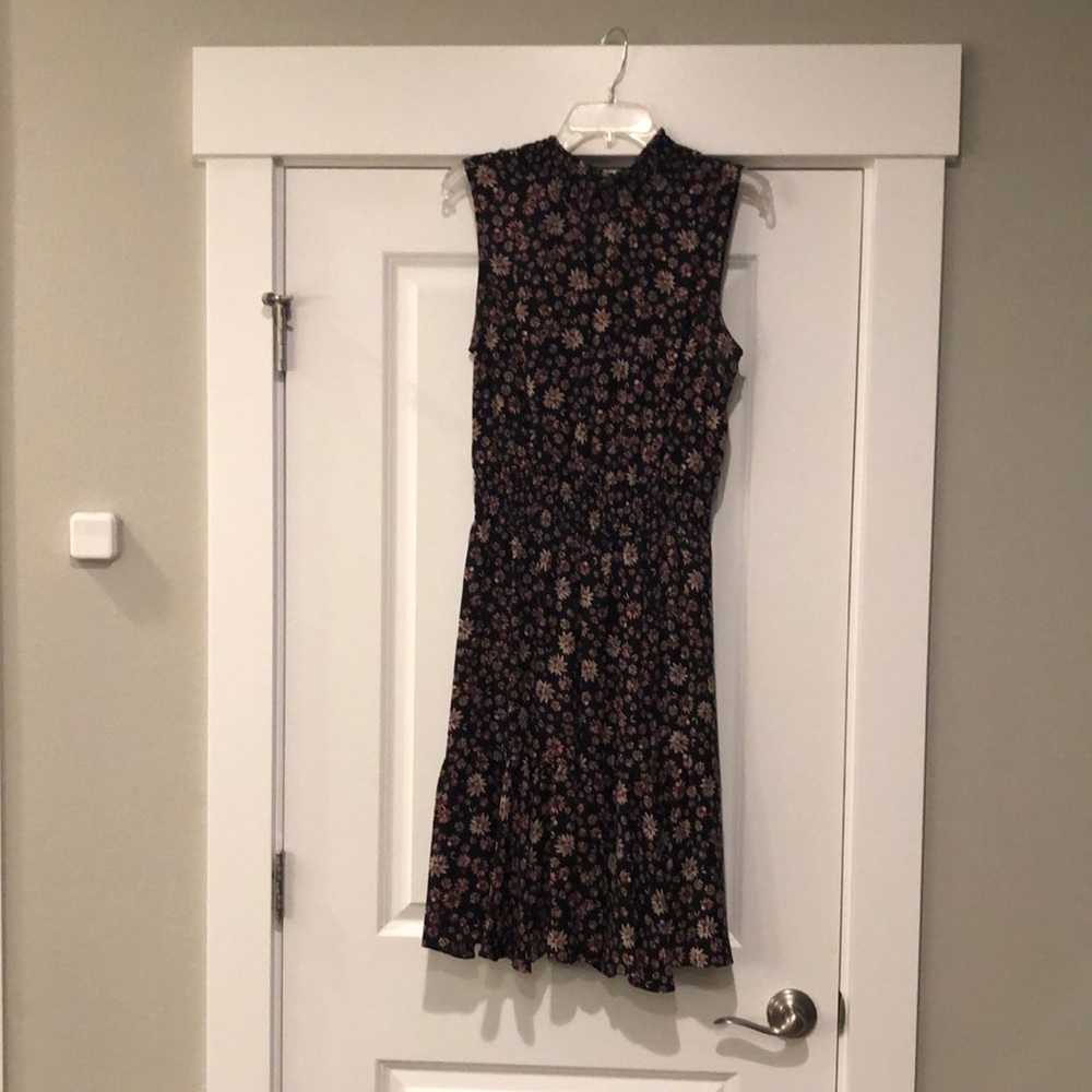High neck, sleeveless dress.